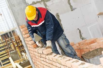 Man Laying Brick and mortar